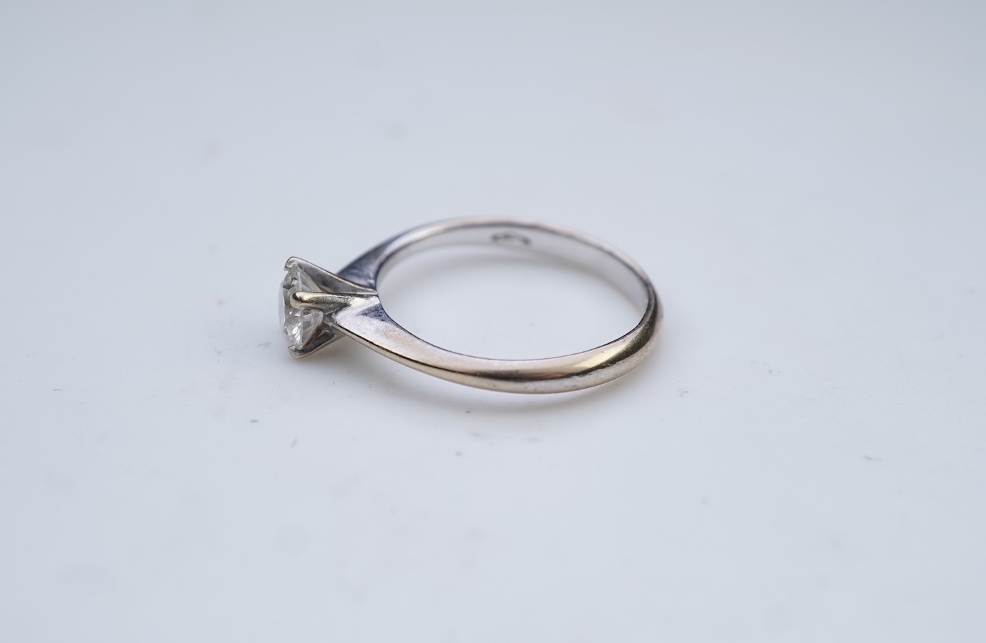 A diamond solitaire ring